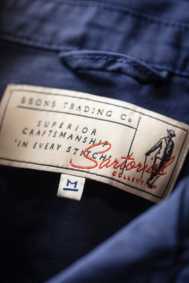 Close-up of a label on a navy blue garment with 'Sartorius' branding.