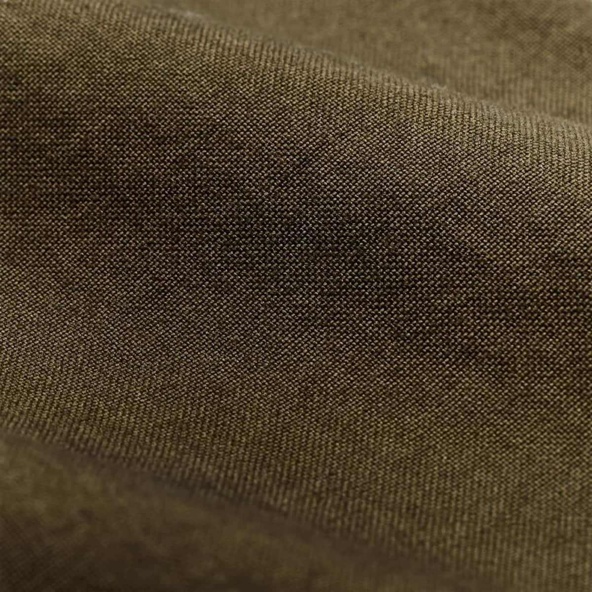 Close-up of a textured Filson olive brown fabric with a fine woven pattern and soft folds.