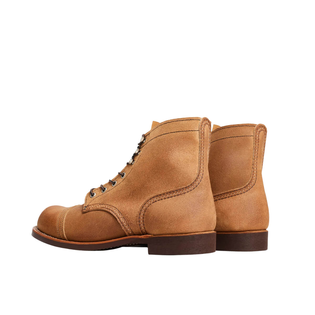 Pair of brown leather boots on a white background