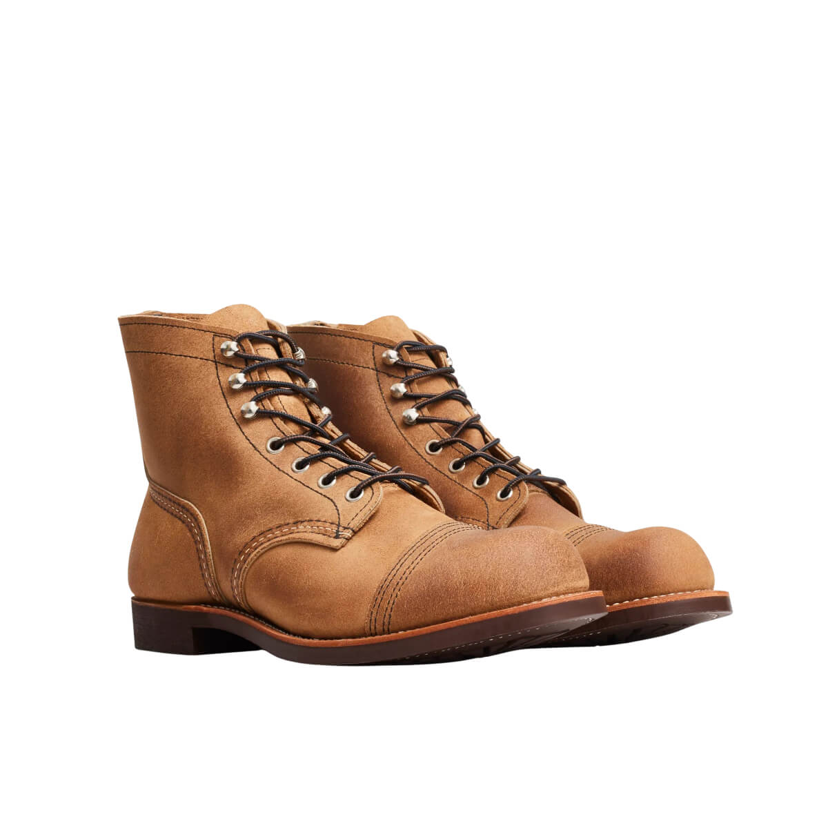 Pair of brown leather boots on a white background