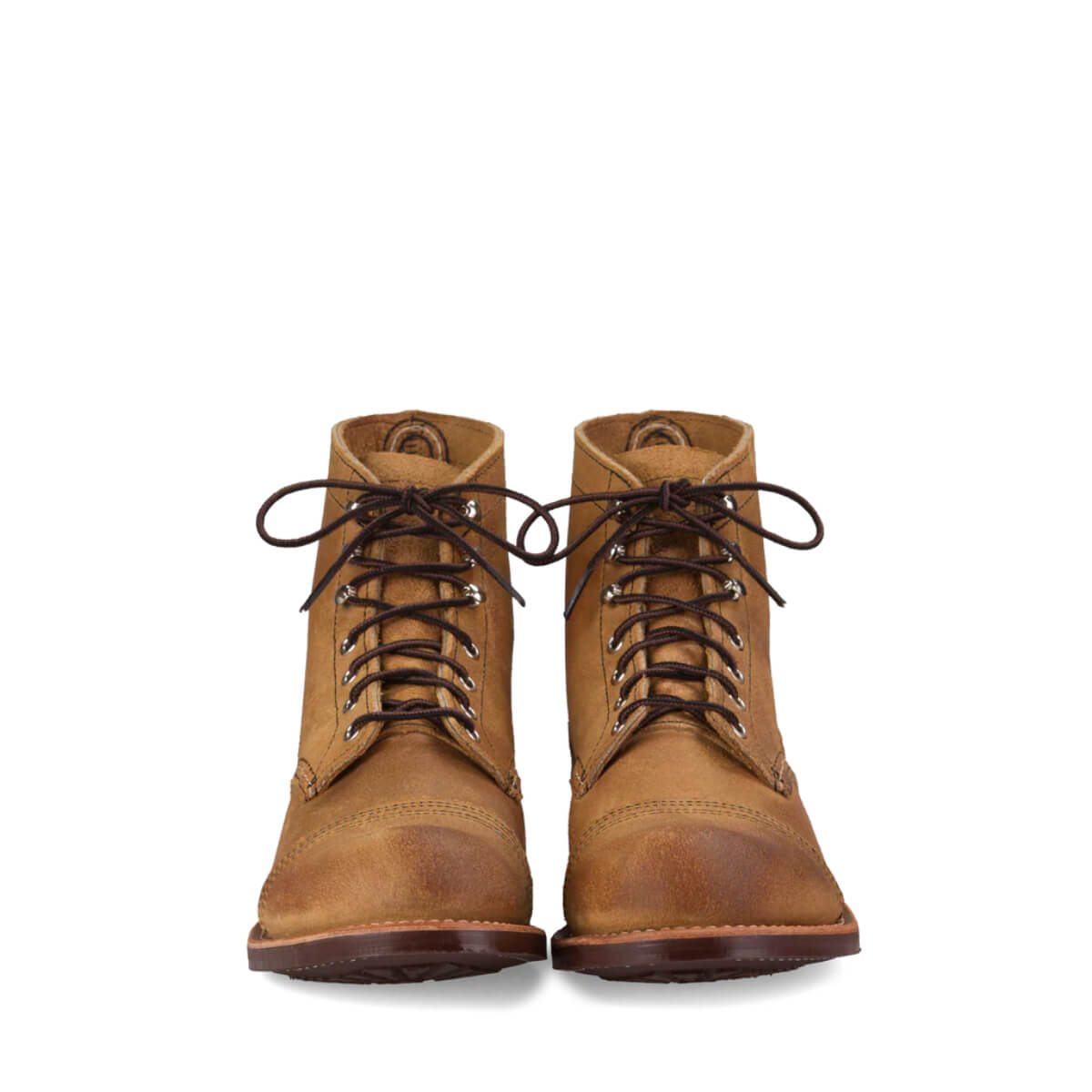 Pair of brown leather boots on a white background