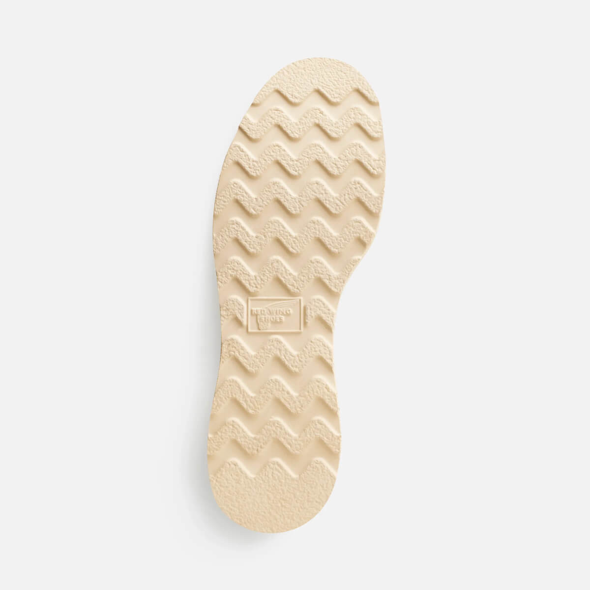 Beige shoe sole with brand logo on a light gray background