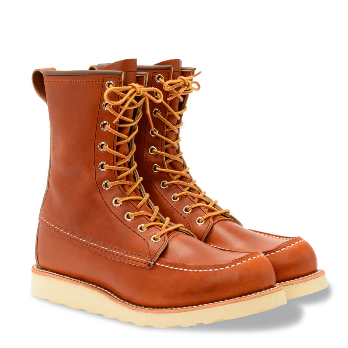 Pair of brown leather boots with yellow laces on a white background