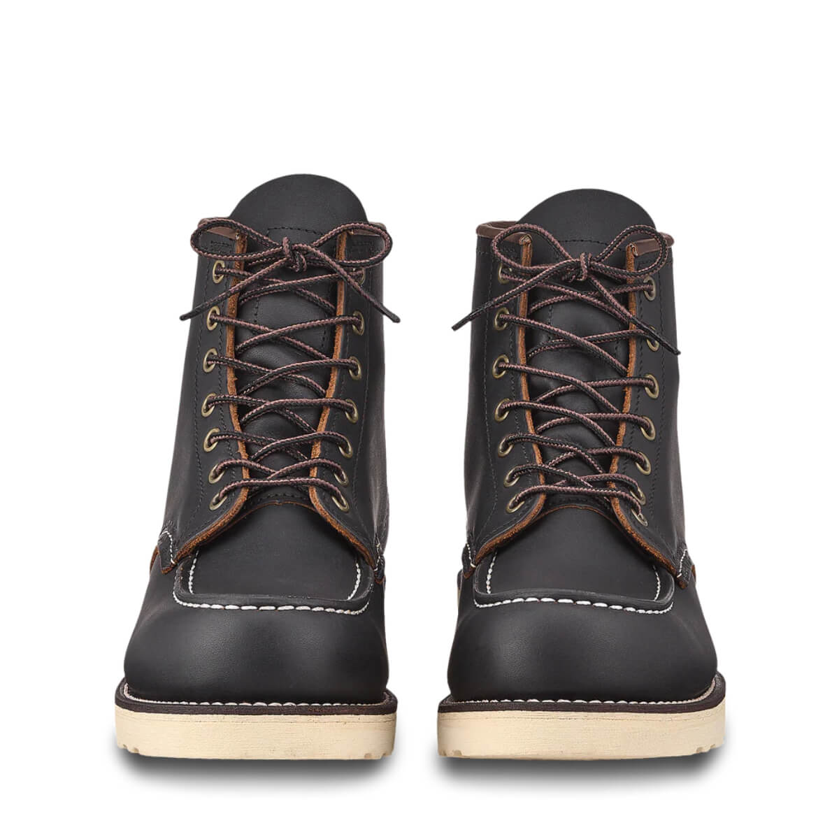 Pair of black leather boots with brown laces on a white background