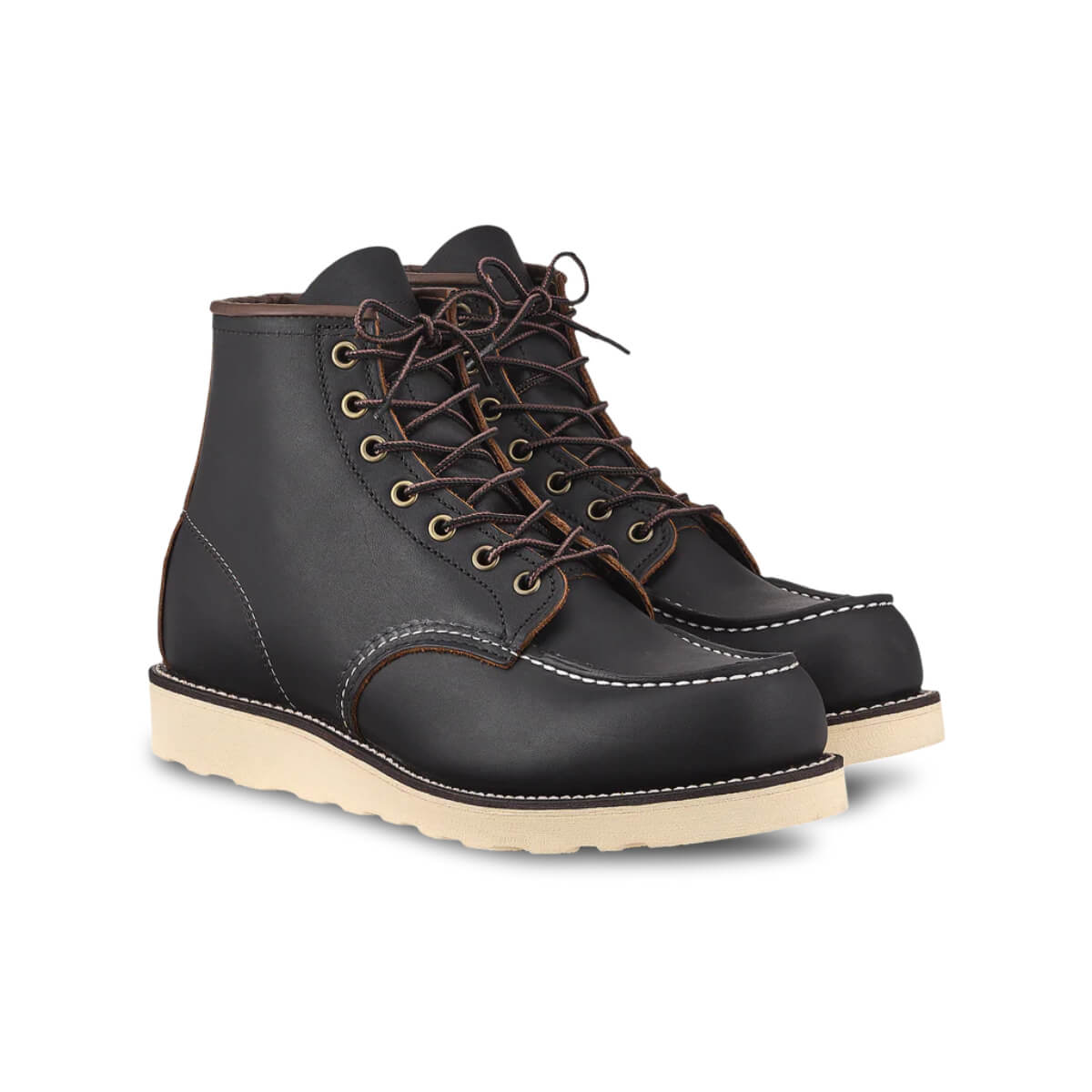 Pair of black leather boots with brown laces on a white background