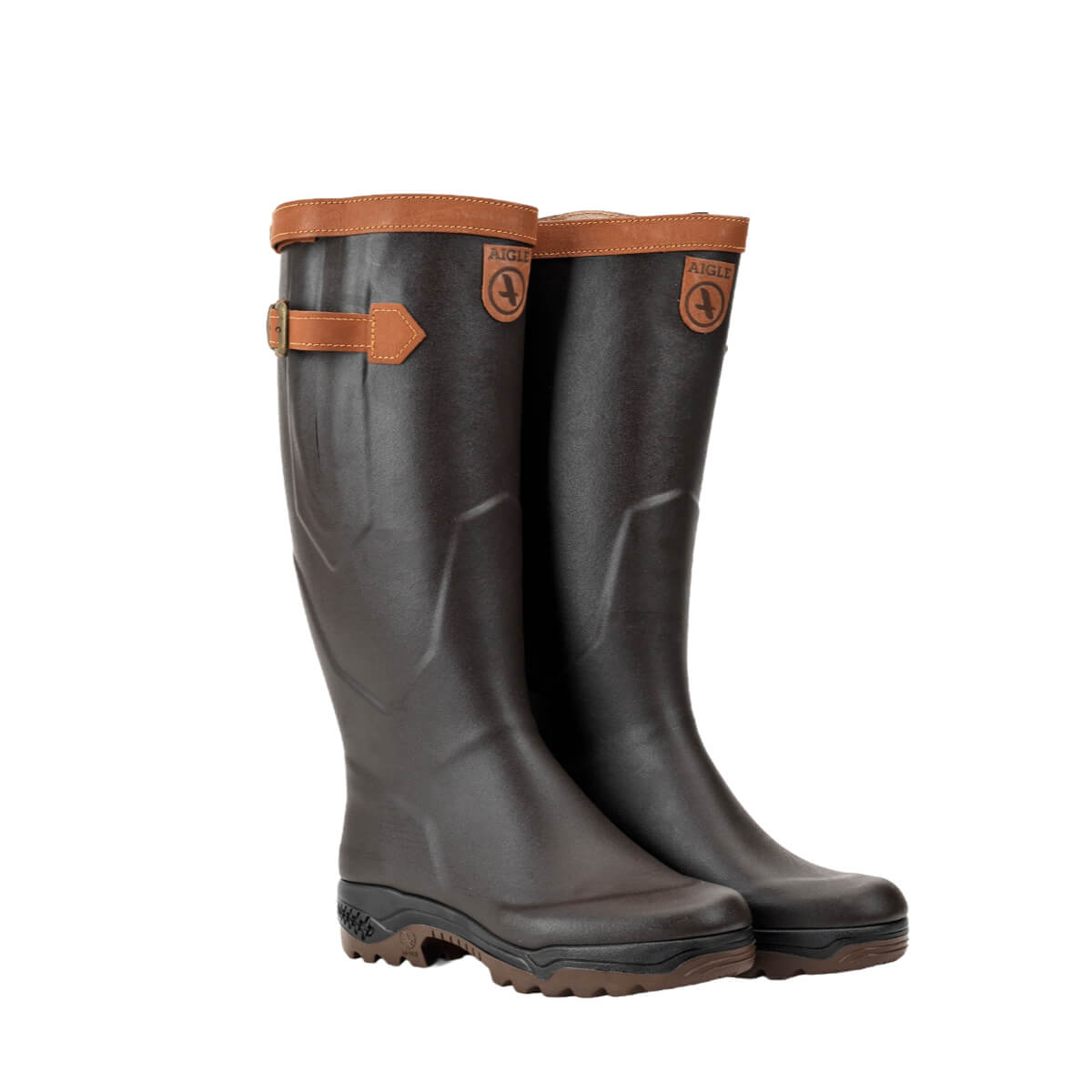 Pair of brown rubber boots with brown leather trim on a white background