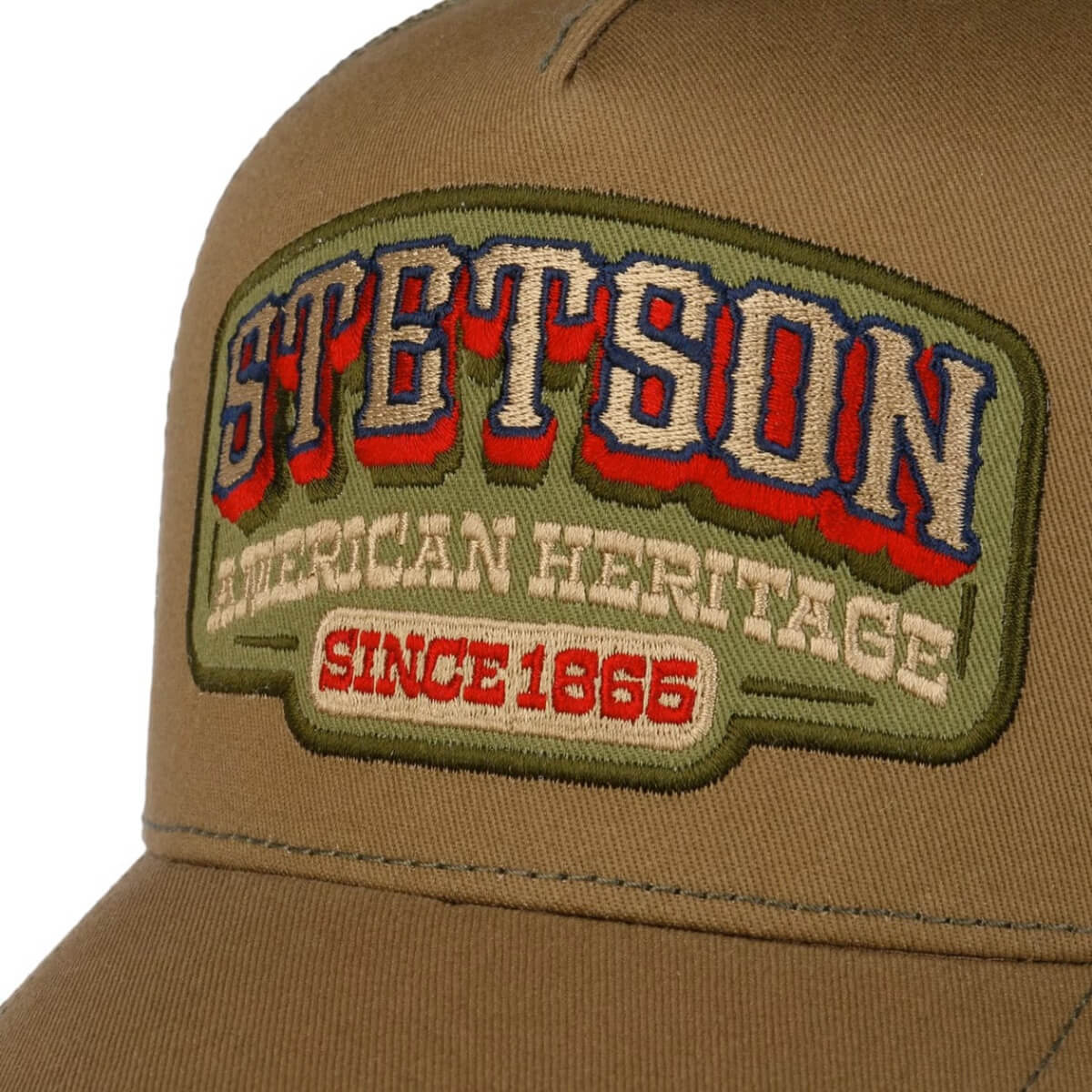 Brown cap with a brand patch on a white background