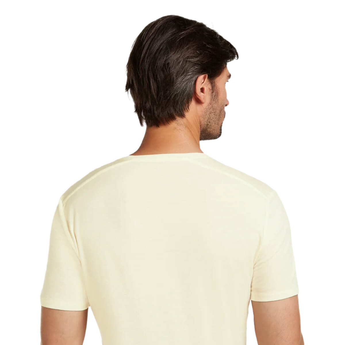 Man wearing an undyed t-shirt on a white background