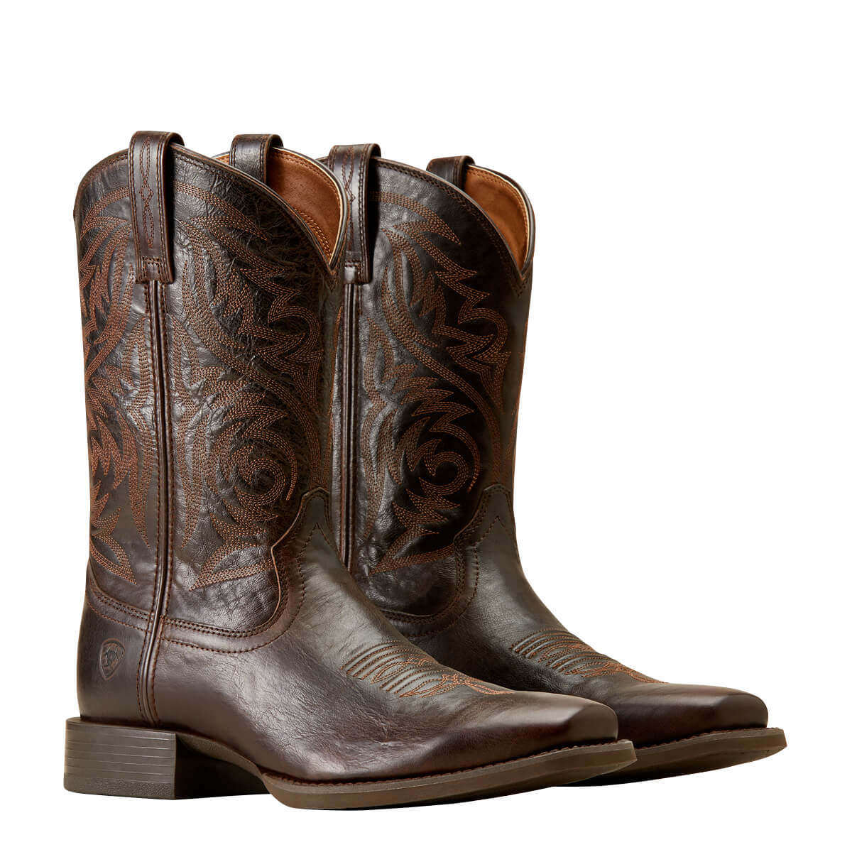Pair of brown Ariat Sport Herdsman cowboy boots with intricate designs on a white background