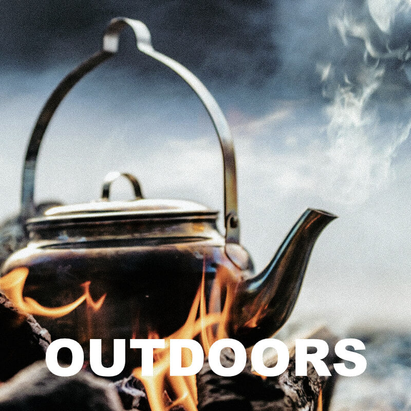Tea kettle on fire with 'OUTDOORS' text overlay