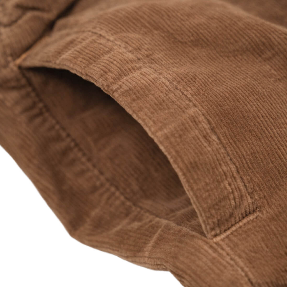 Close-up of brown corduroy fabric with a visible texture