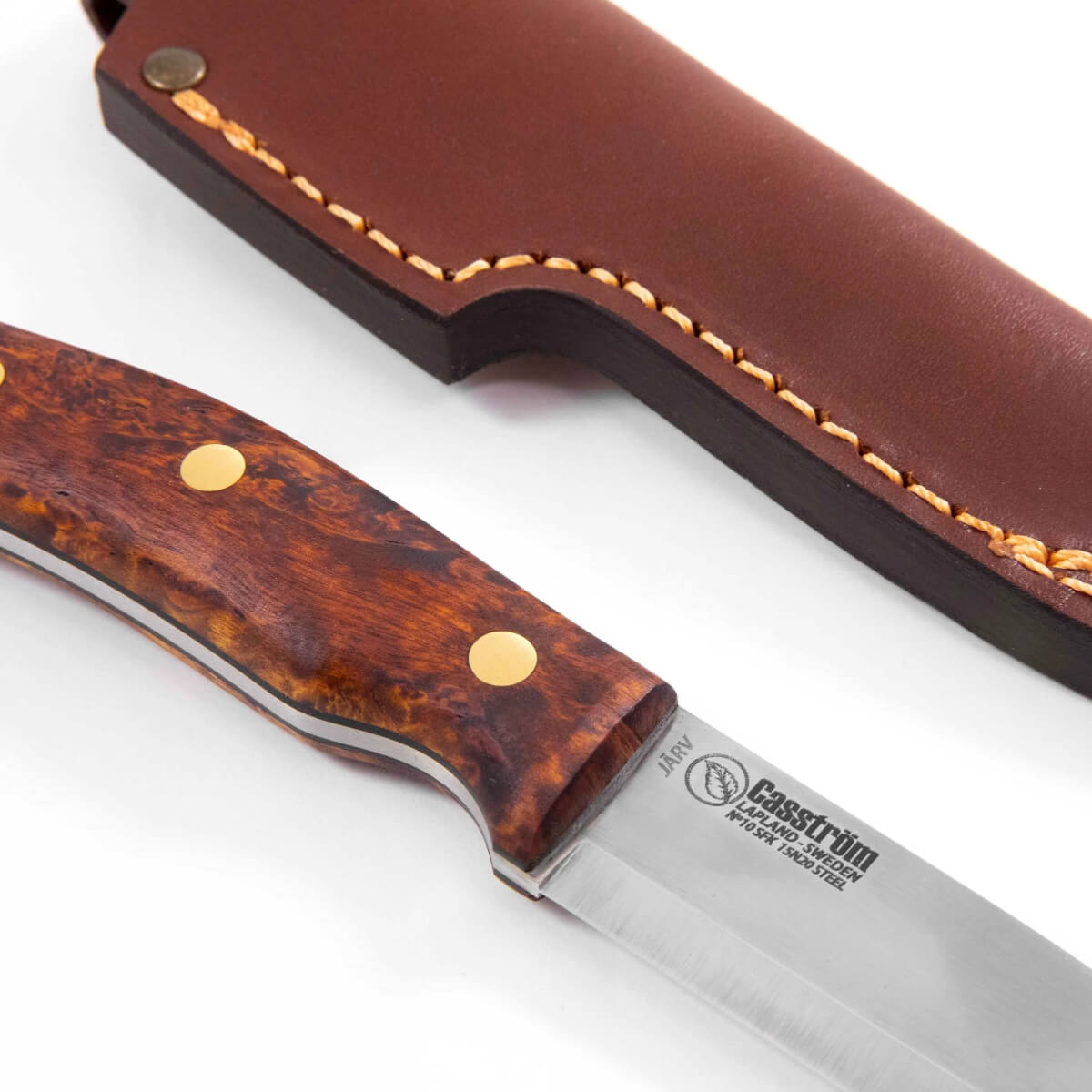 Knife with tortoiseshell handle and leather sheath on a white background