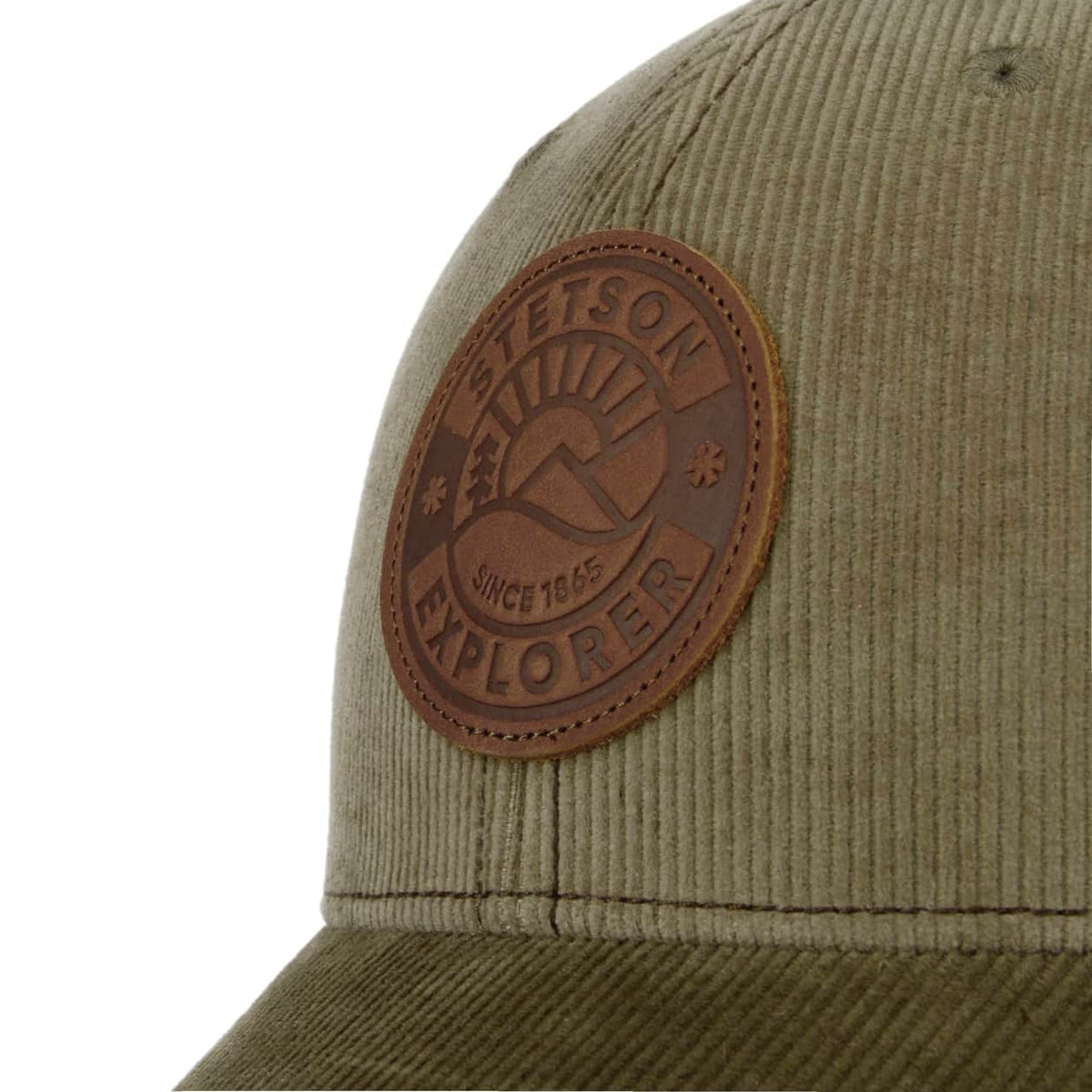 Olive green cap with a brown leather patch on a white background