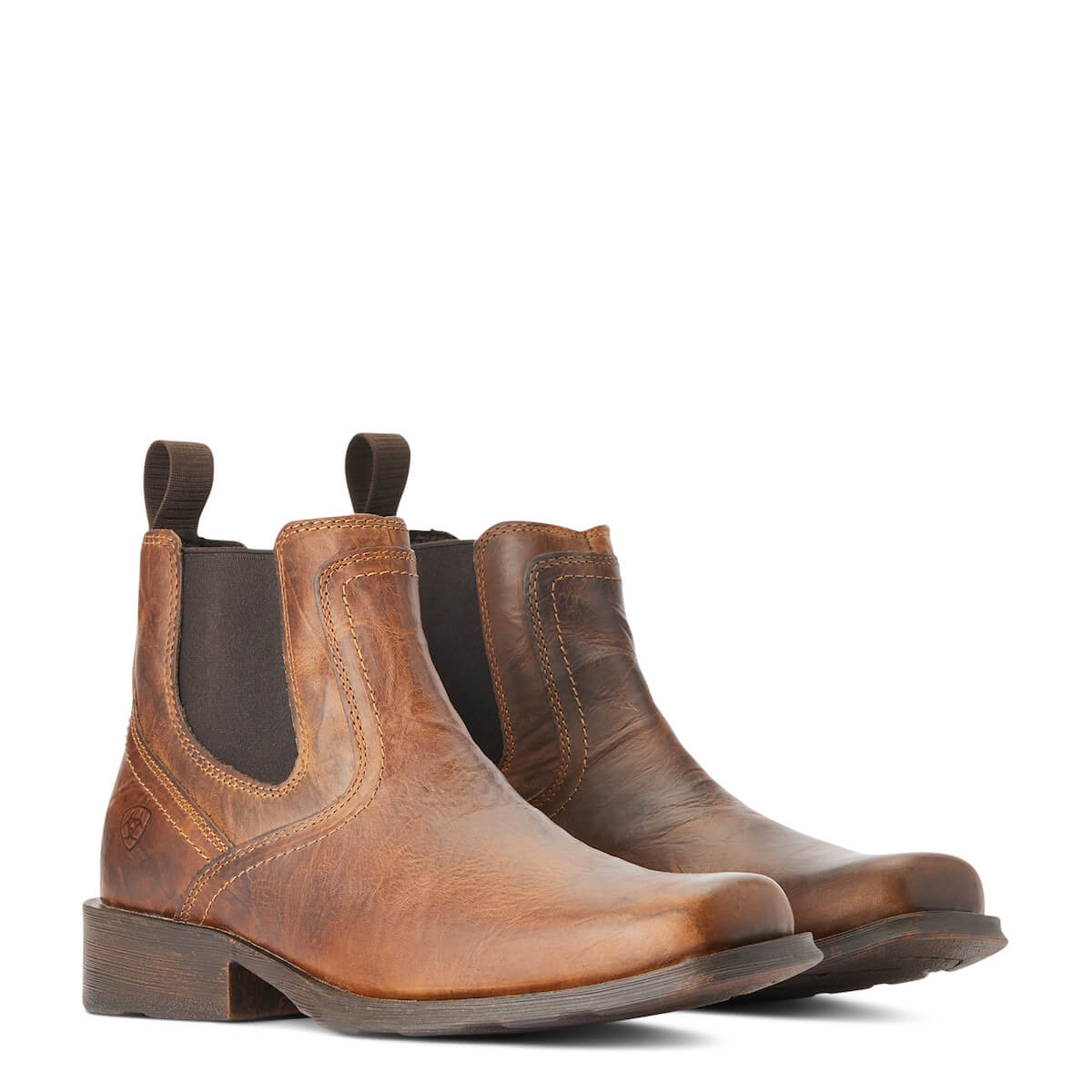 Pair of brown leather boots on a white background