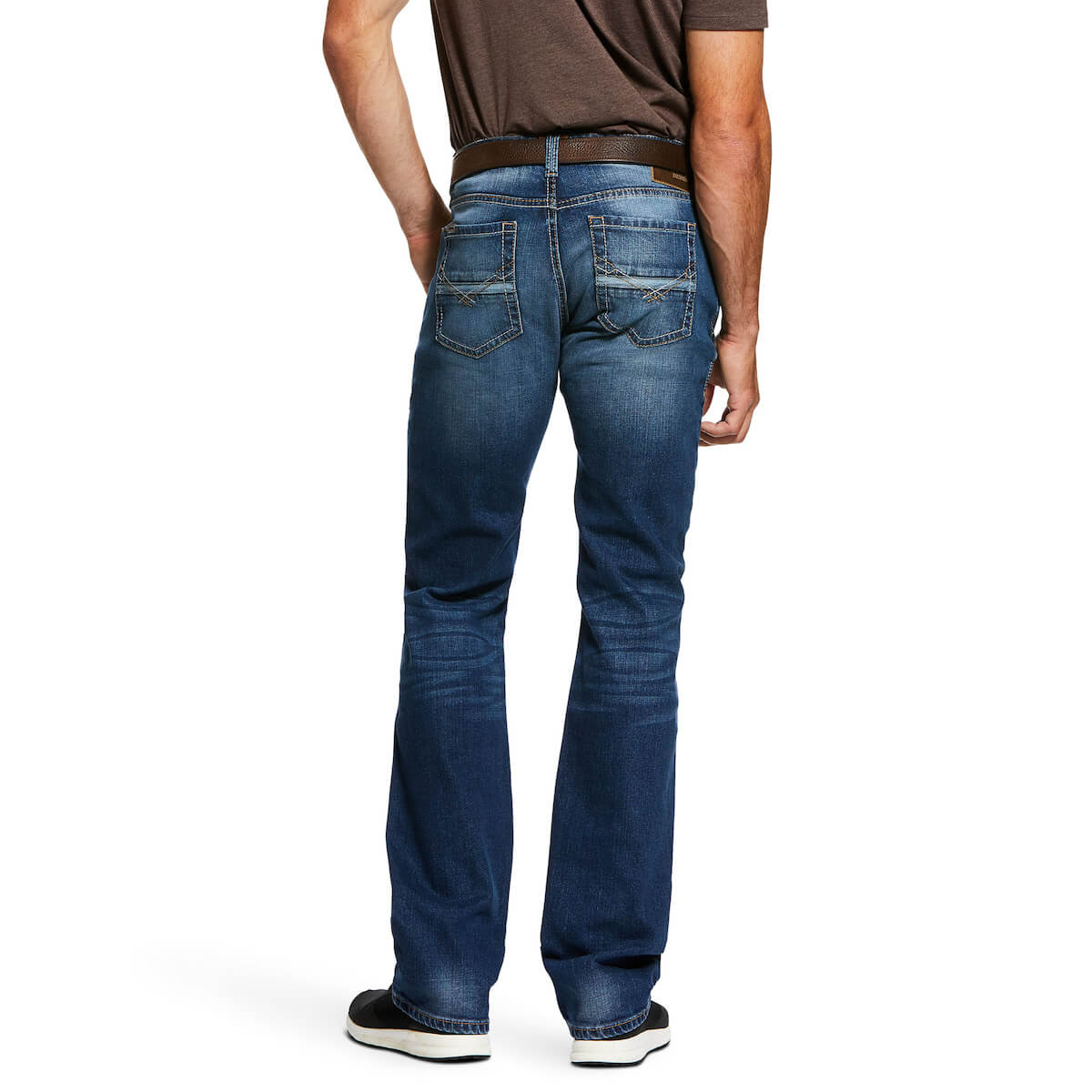 Person wearing blue jeans on a white background