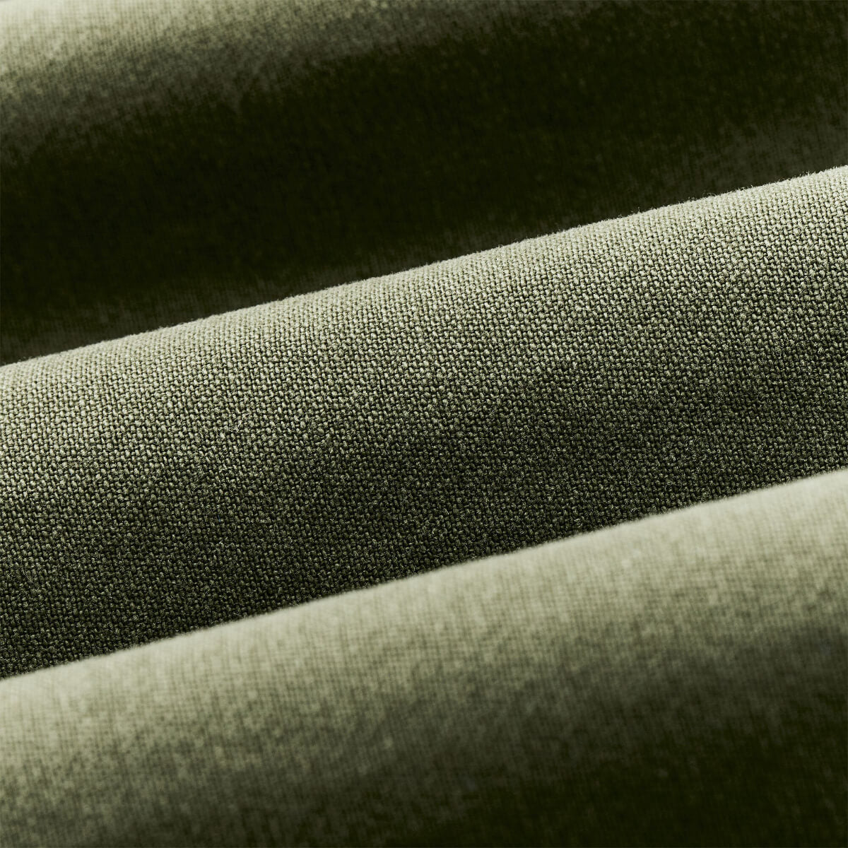 Close-up of green fabric with a textured surface