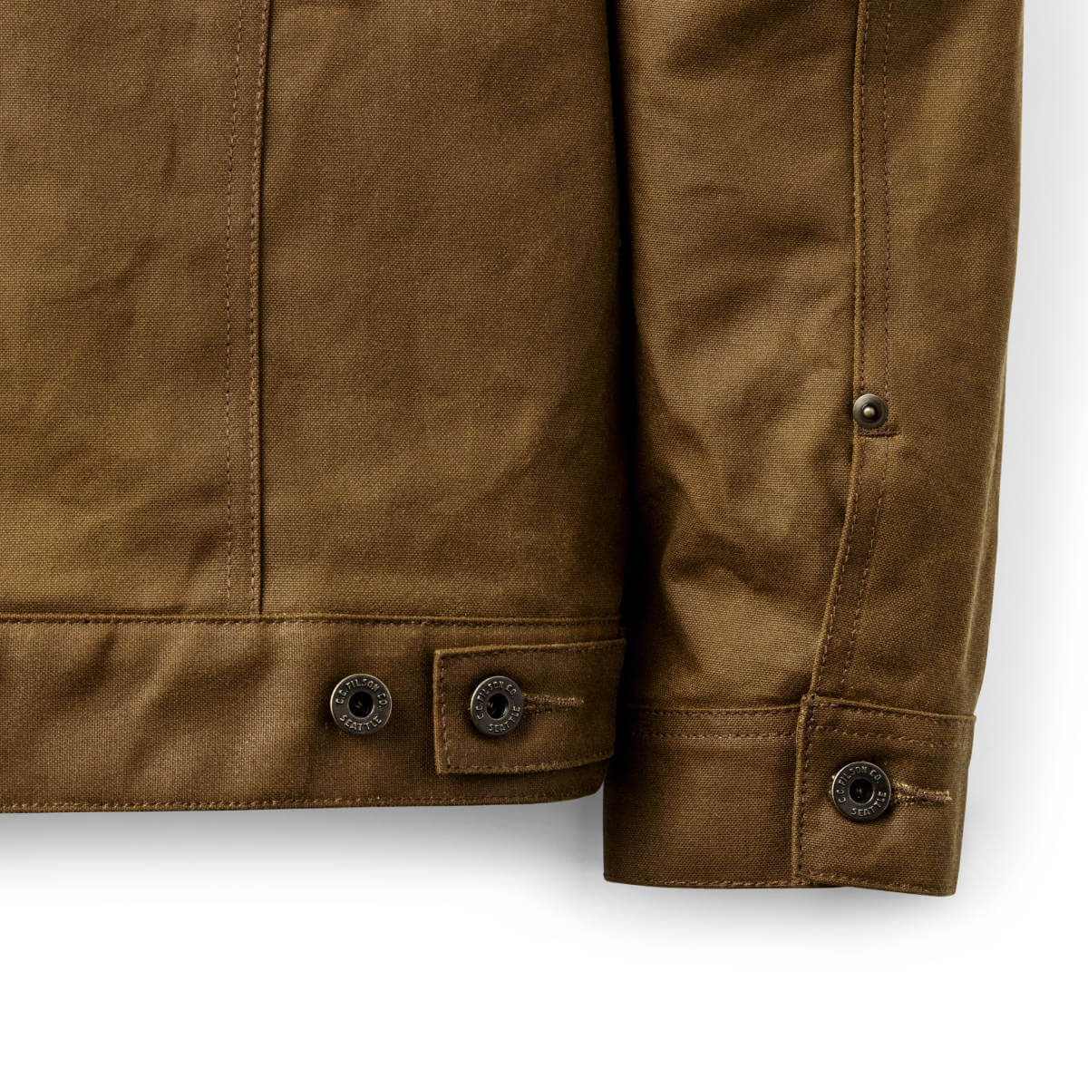Close-up of a brown jacket with buttons on a white background