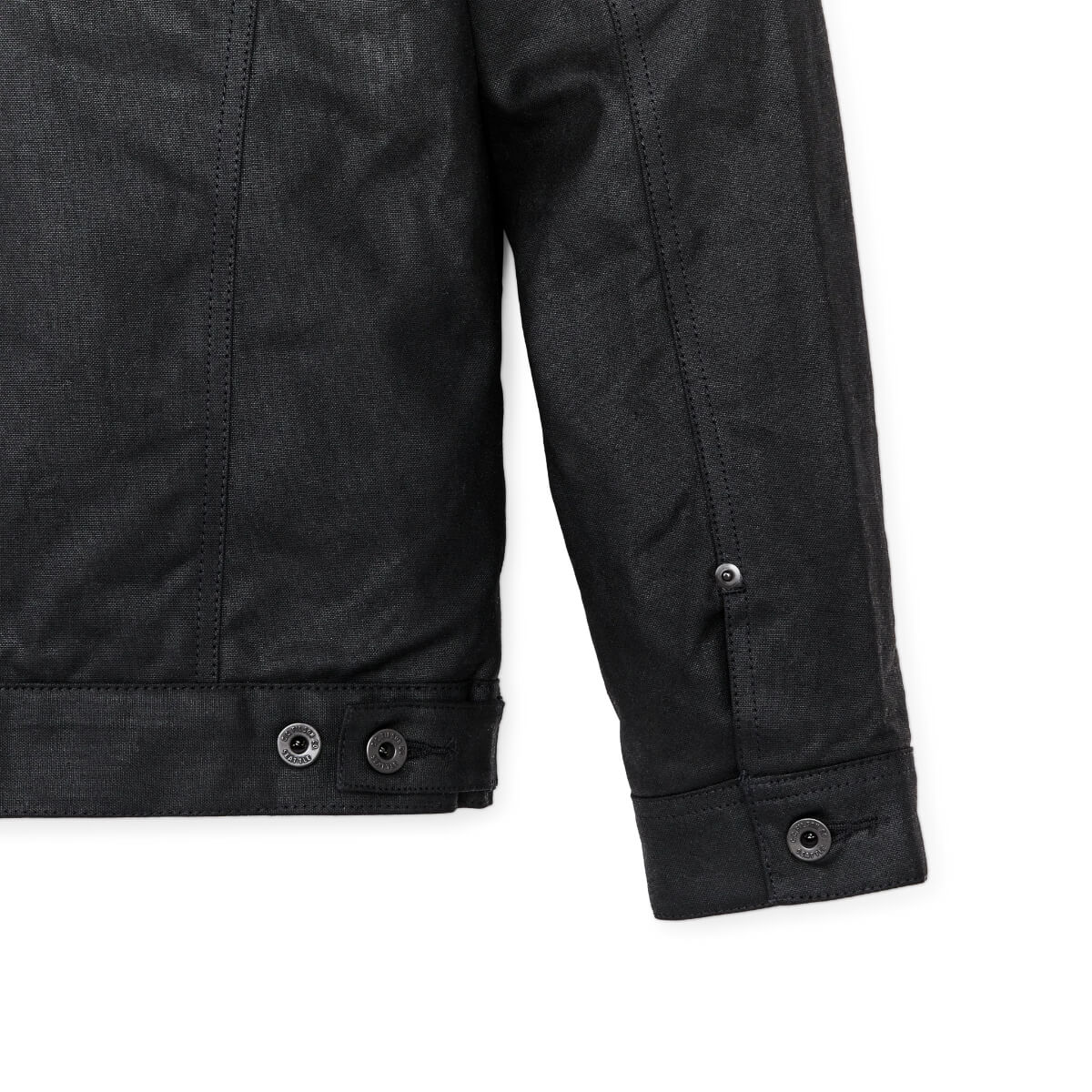 Close-up of a black jacket with buttons on a white background