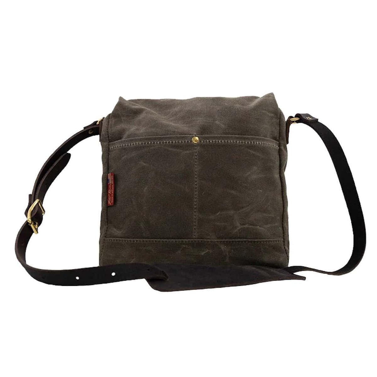 Frost River Archaeologist Satchel with an adjustable leather strap and gold-tone hardware, shown against a plain white background.