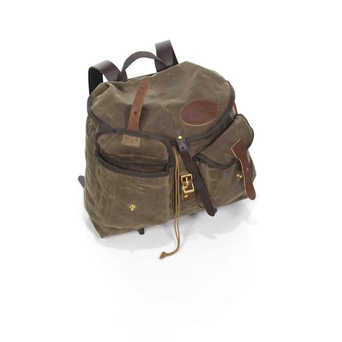 An olive green waxed canvas backpack with dark brown leather straps, trim, and hardware, shown on a clean white background.
