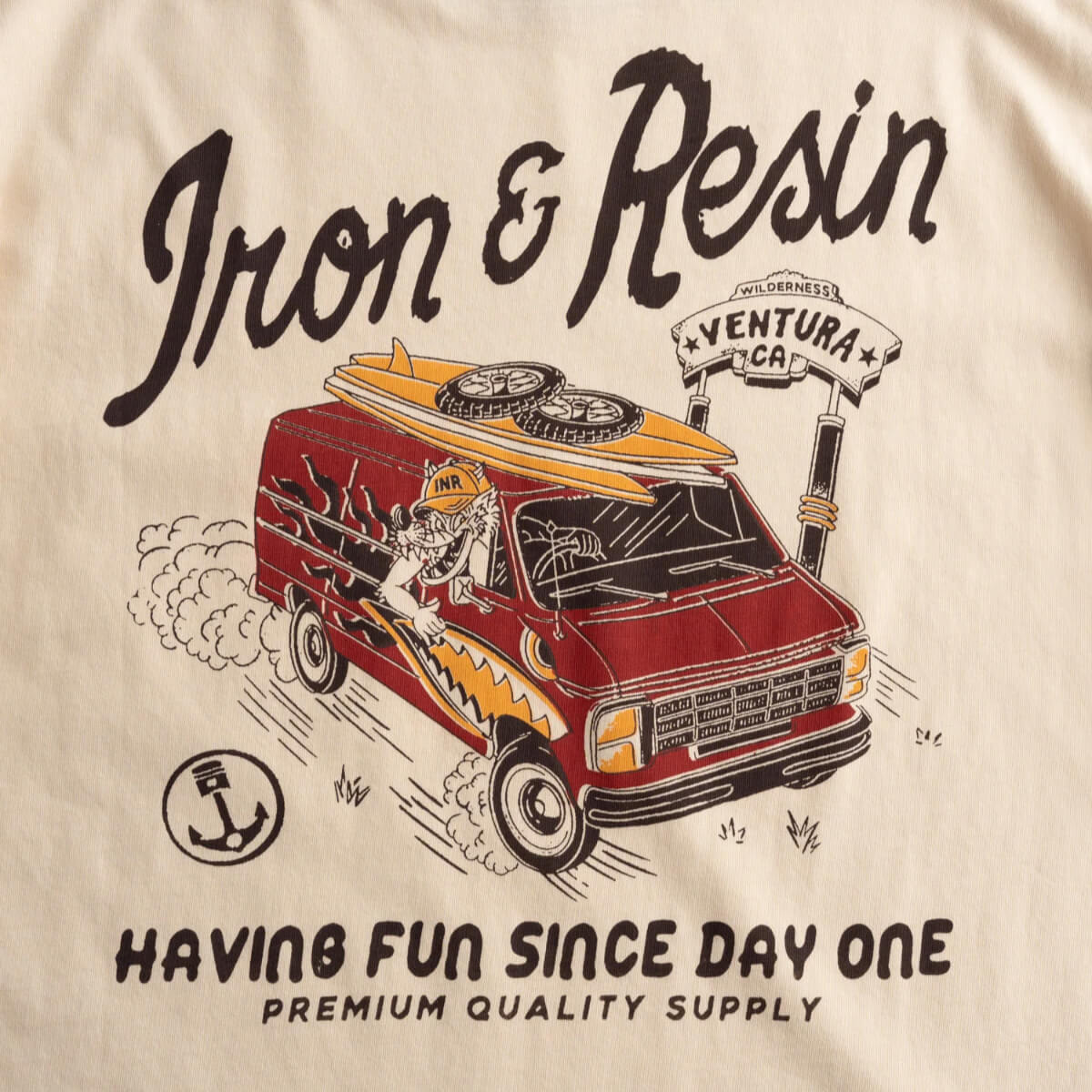 Beige t-shirt with a red van graphic and text 'Iron & Resin' on a beige background