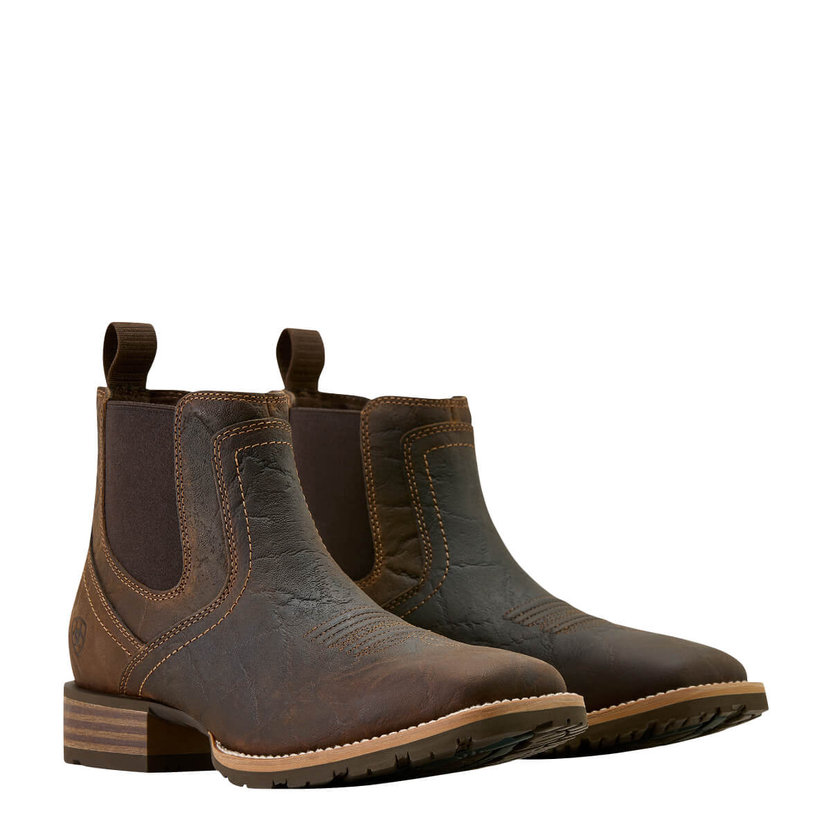Pair of brown leather boots on a white background