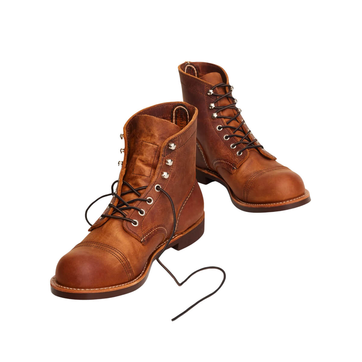 Pair of brown leather boots on a white background