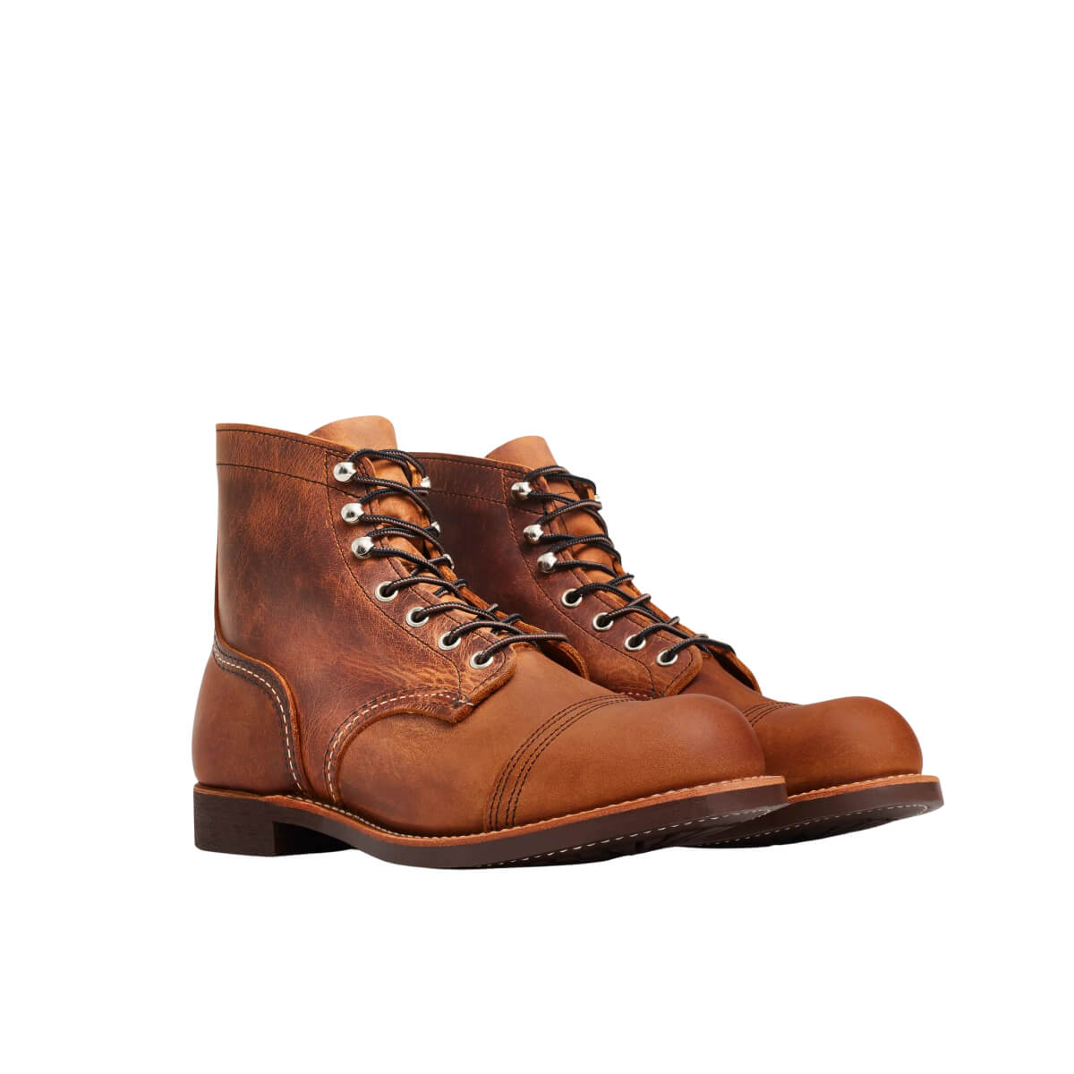 Pair of brown leather boots on a white background