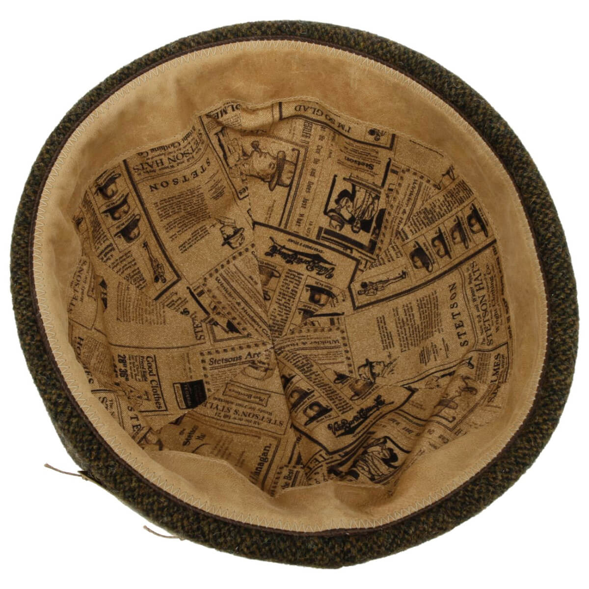 Docker hat with newspaper print on a beige background