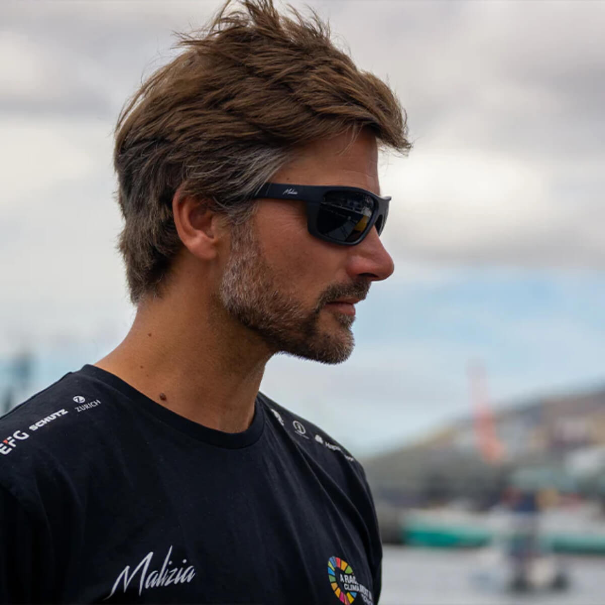 Man wearing sunglasses with a blurred background