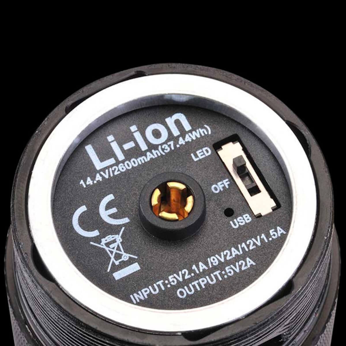Close-up of a Li-ion battery pack with USB and LED indicators on a black background