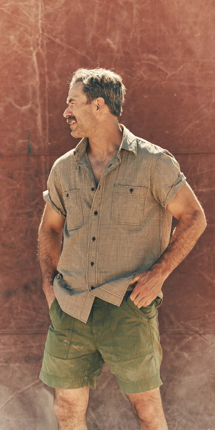 Man wearing Filson shirt and shorts