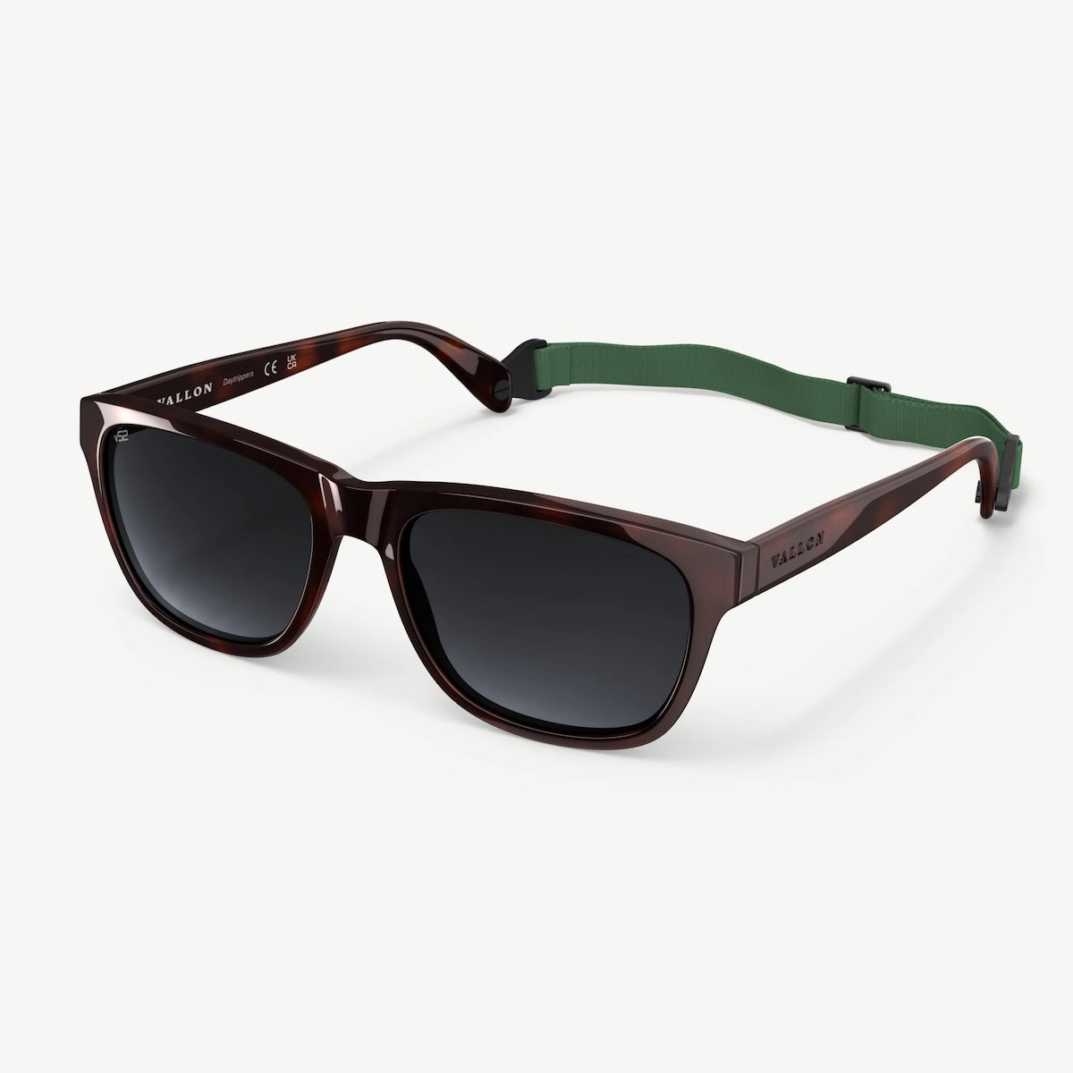 Sunglasses with a green strap on a white background