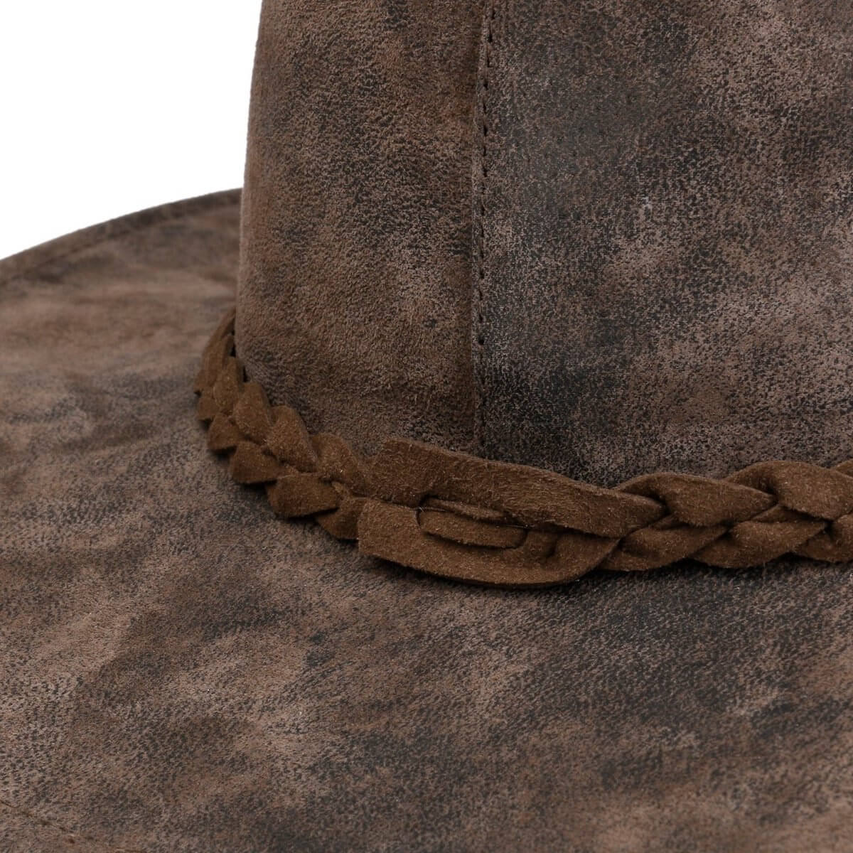 Close-up of a brown suede hat with braided leather band on a white background
