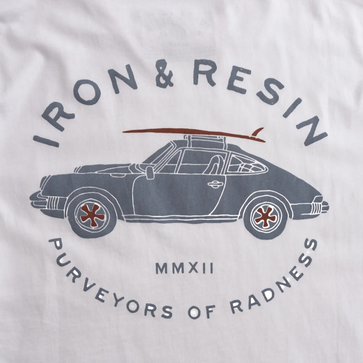 T-shirt with a car graphic and 'Iron & Resin' branding on a light gray background
