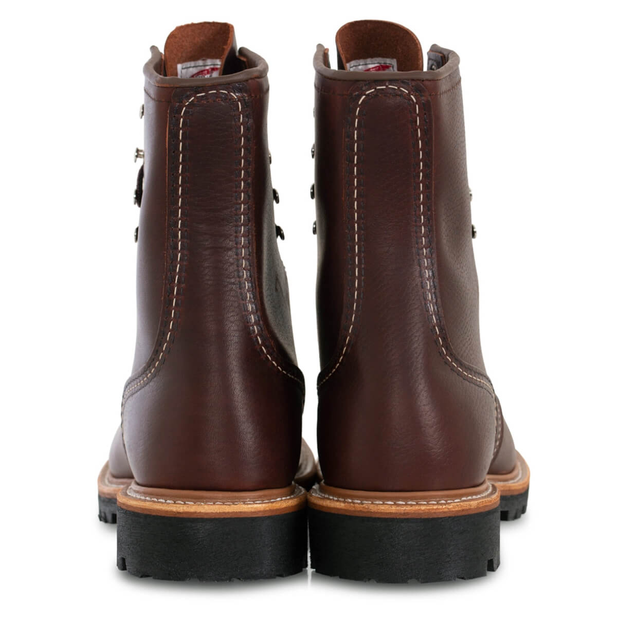 Pair of brown leather boots on a white background