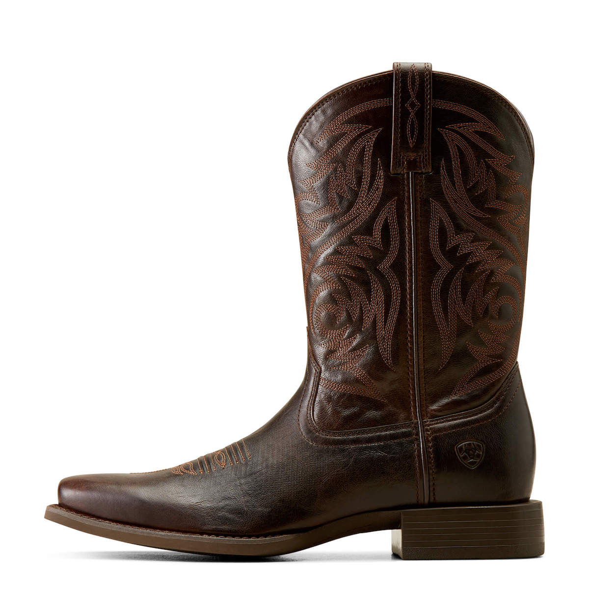 Brown leather cowboy boot with intricate embossing on a white background