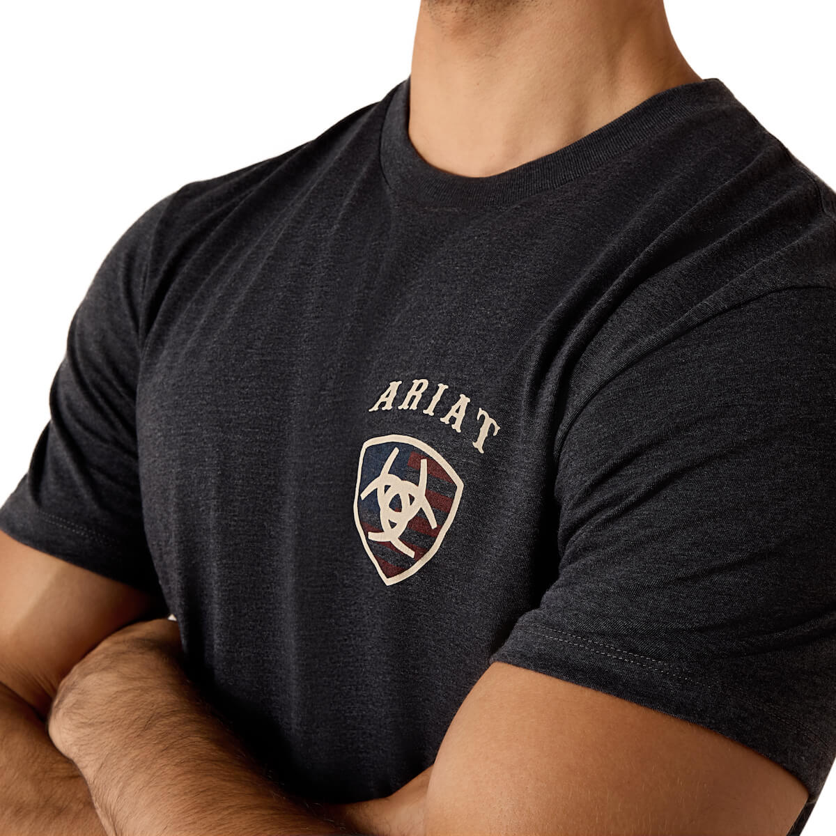 Person wearing a black t-shirt with Ariat logo