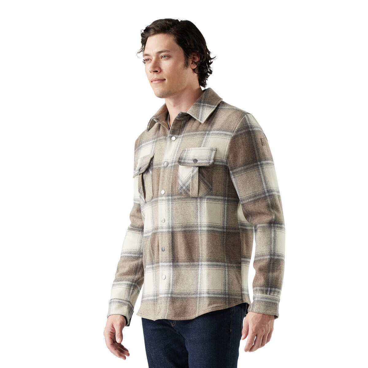 Man wearing a plaid shirt on a white background