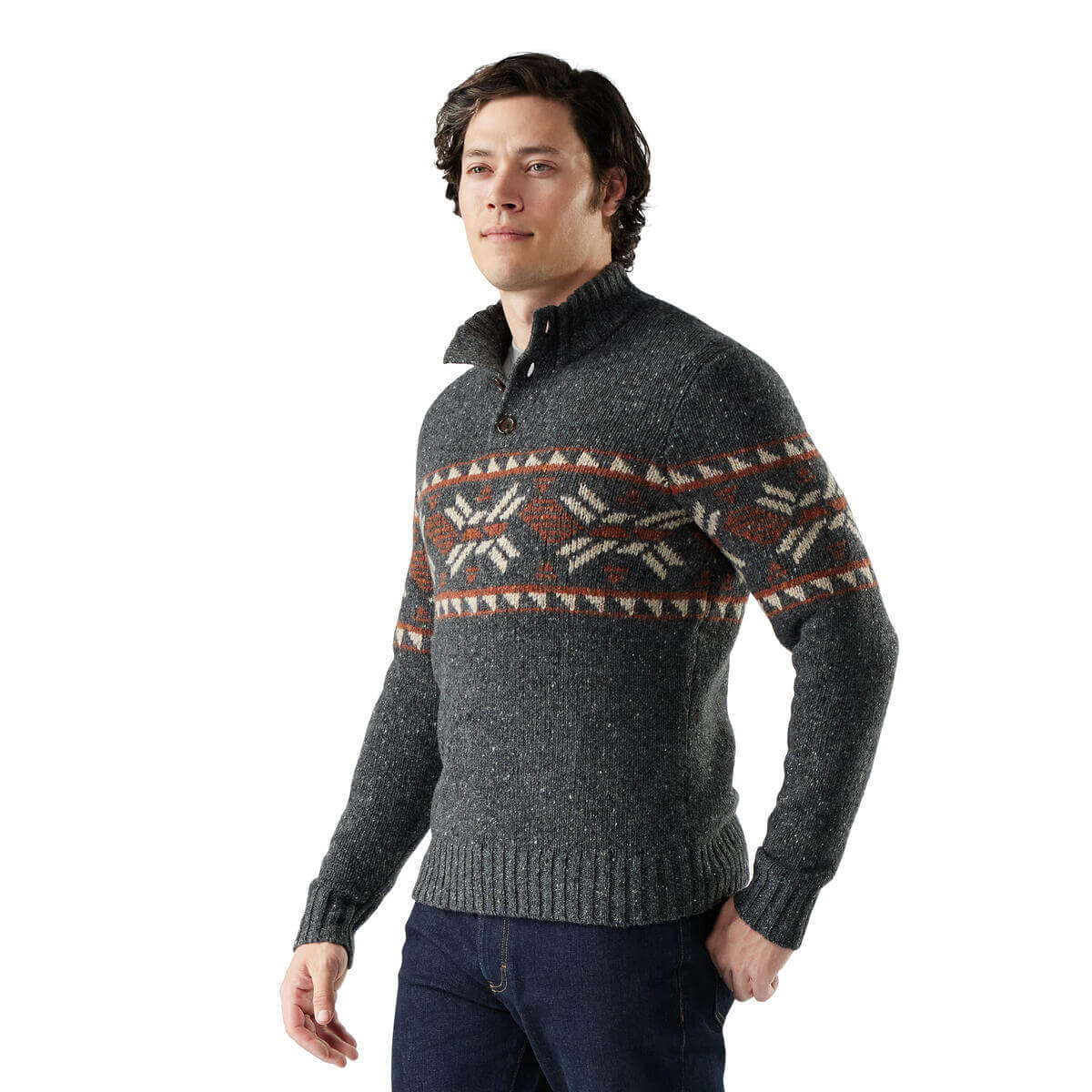 Man wearing a gray sweater with a patterned design on a white background