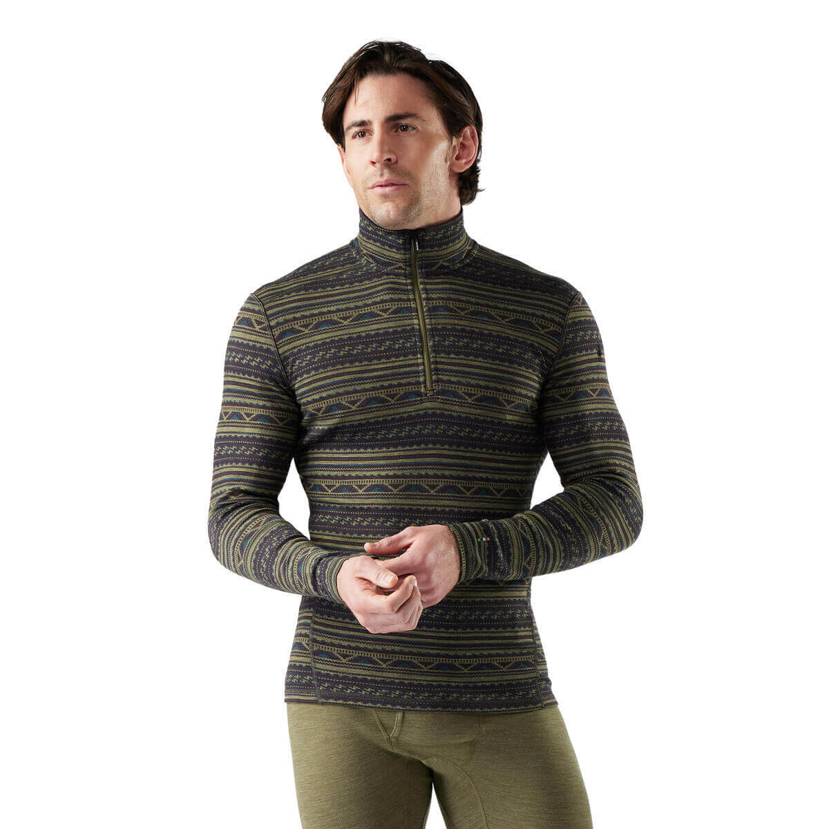Man wearing a patterned green and black sweater on a white background