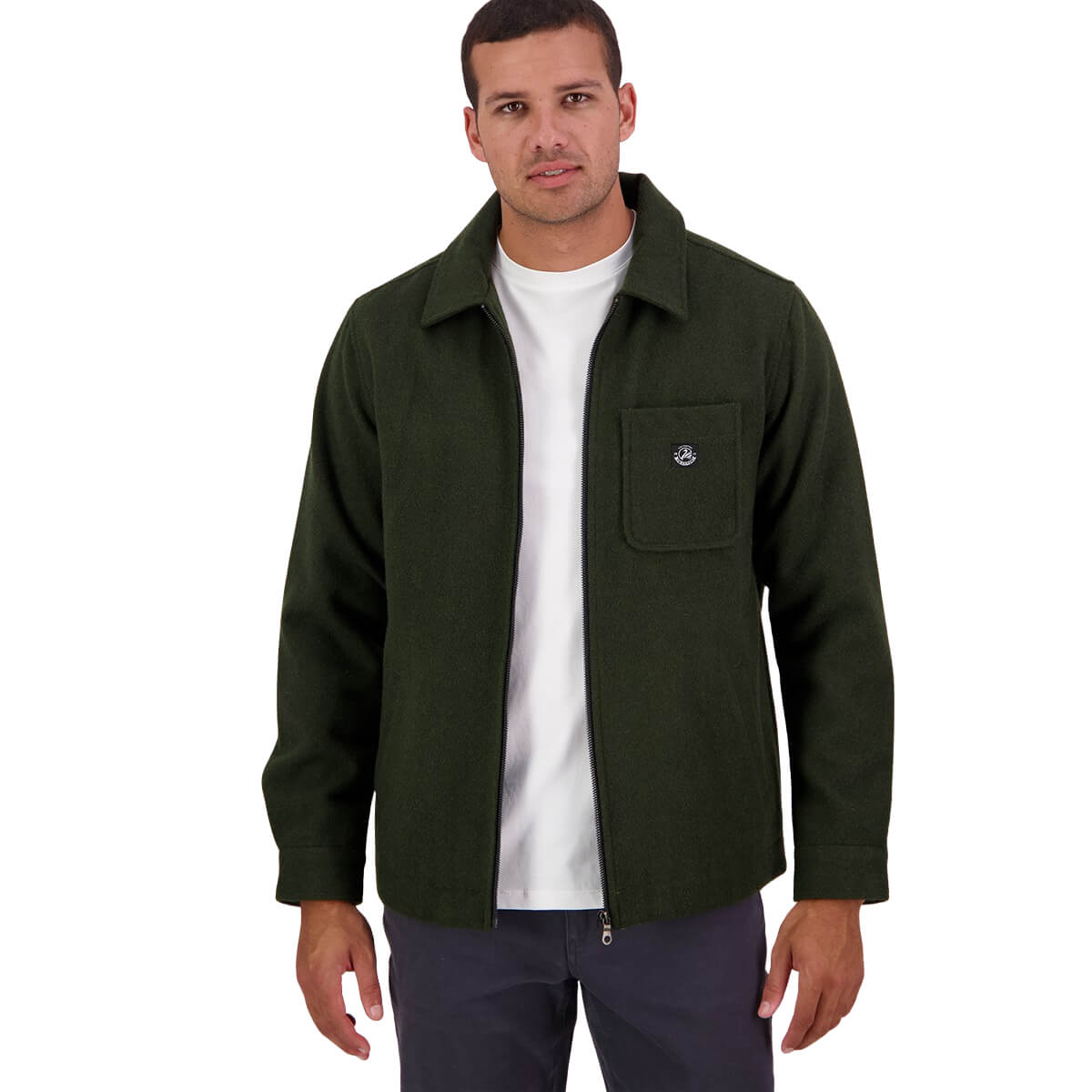 Man wearing a green jacket over a white shirt on a white background
