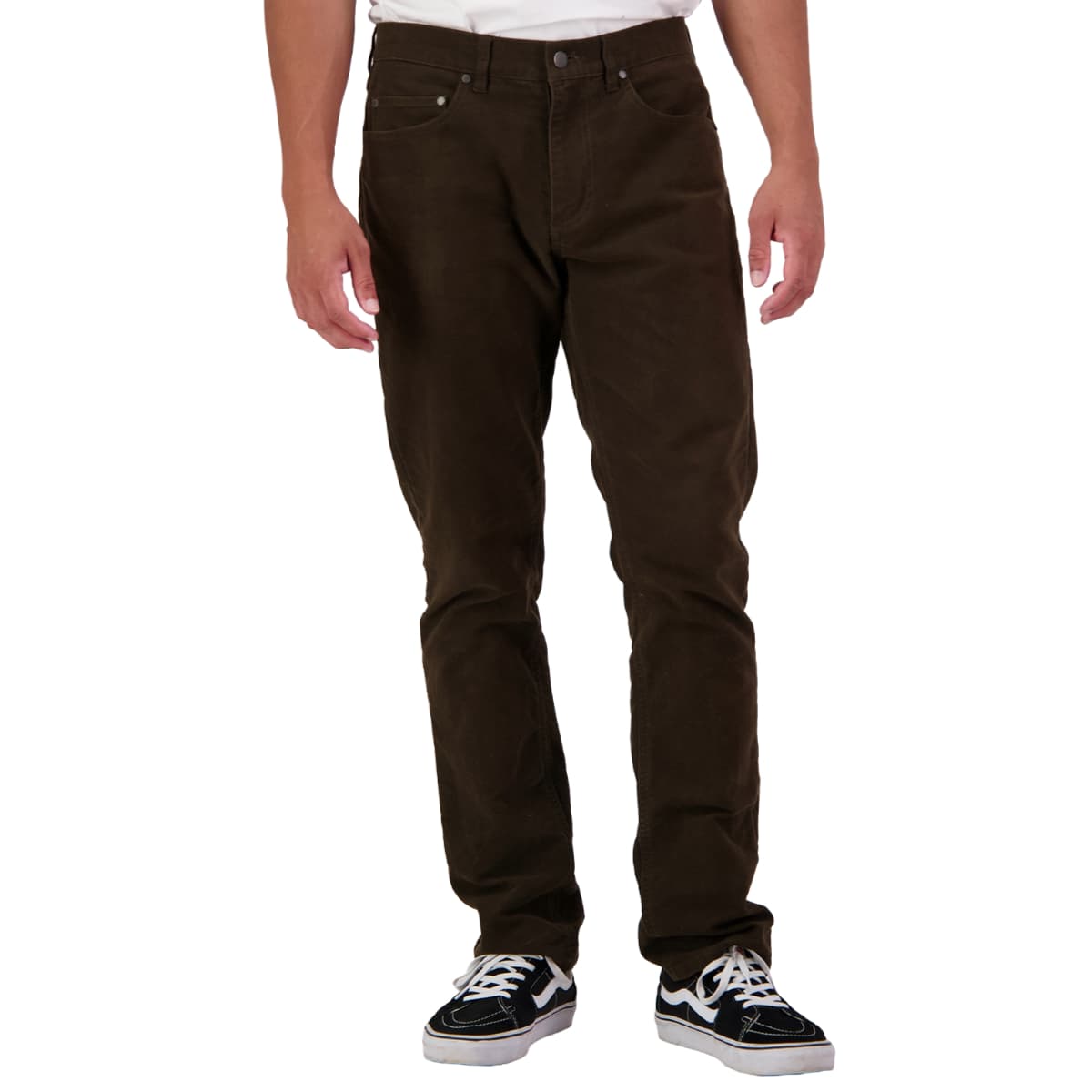 A person wearing dark brown slim-fit jeans and black-and-white sneakers, shown from the waist down against a plain white background.