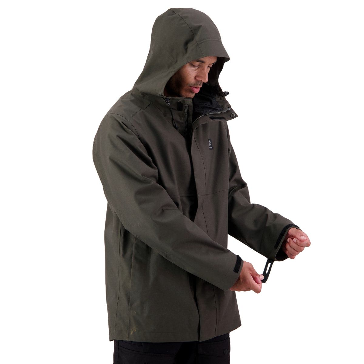 A man wearing an olive green hooded jacket, shown from the waist up against a plain white background, adjusting the collar and zipper area of the jacket.