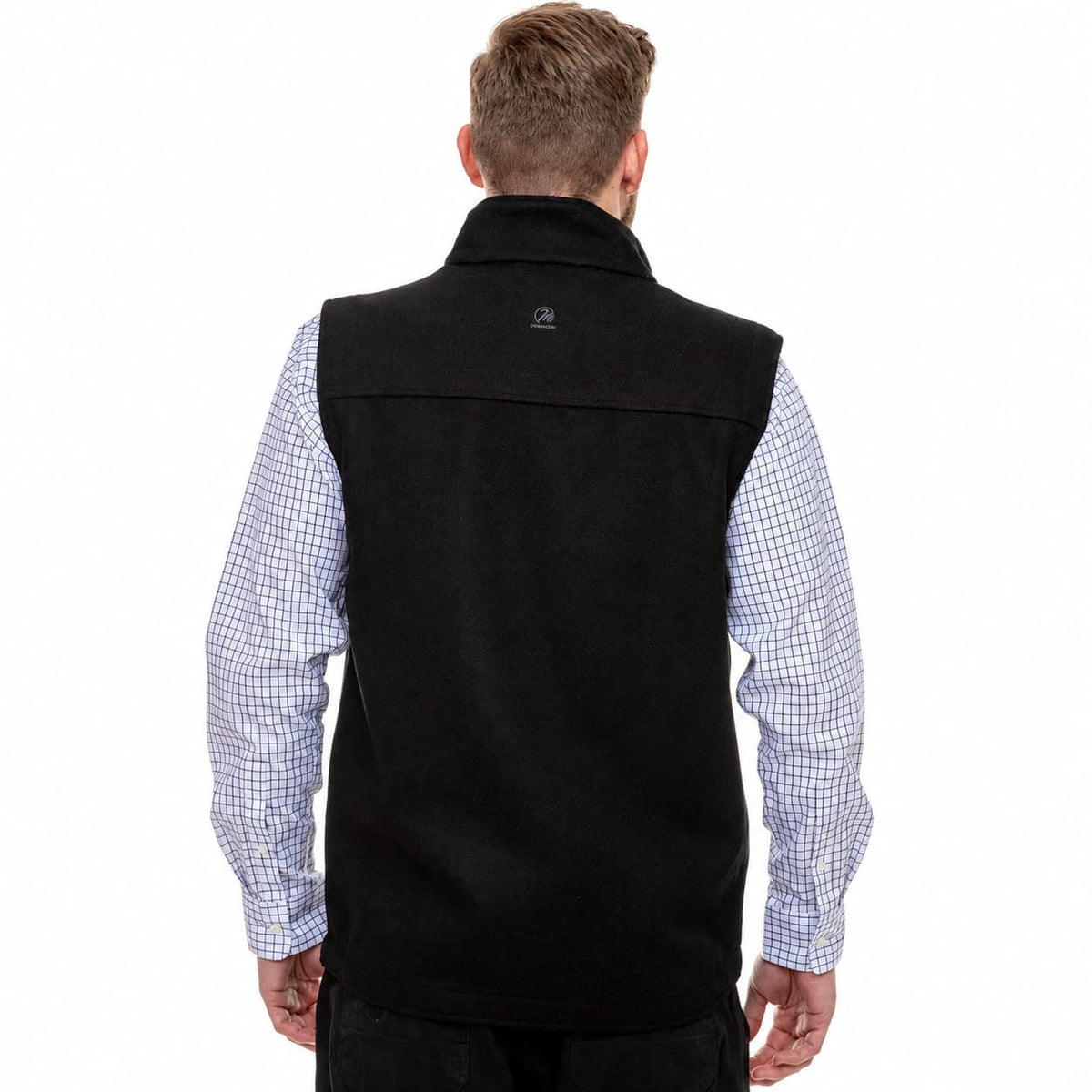 A man viewed from behind wearing a black fleece vest over a light blue and white checkered long-sleeve shirt, against a plain white background.