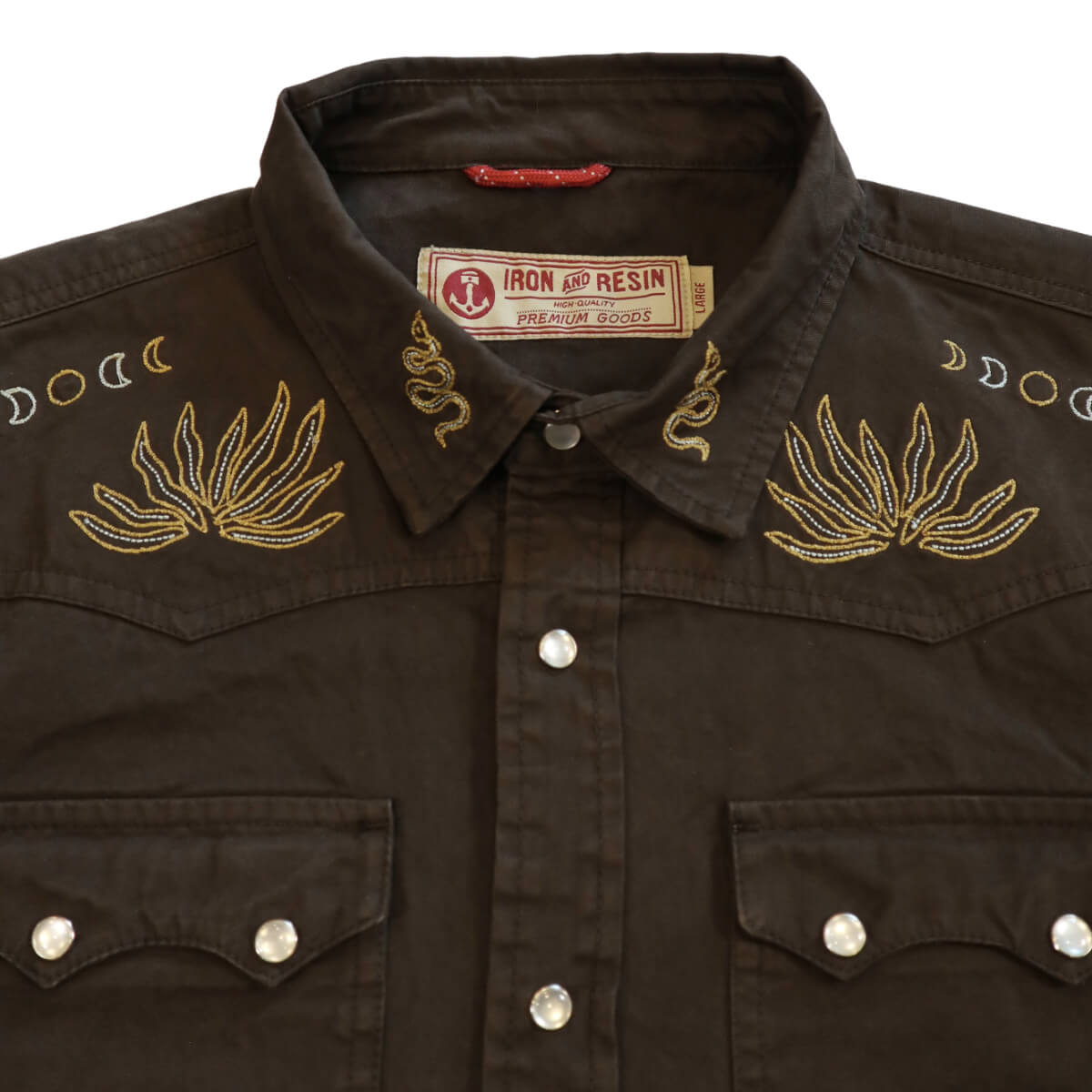 Brown embroidered shirt with decorative elements and Iron & Resin label.