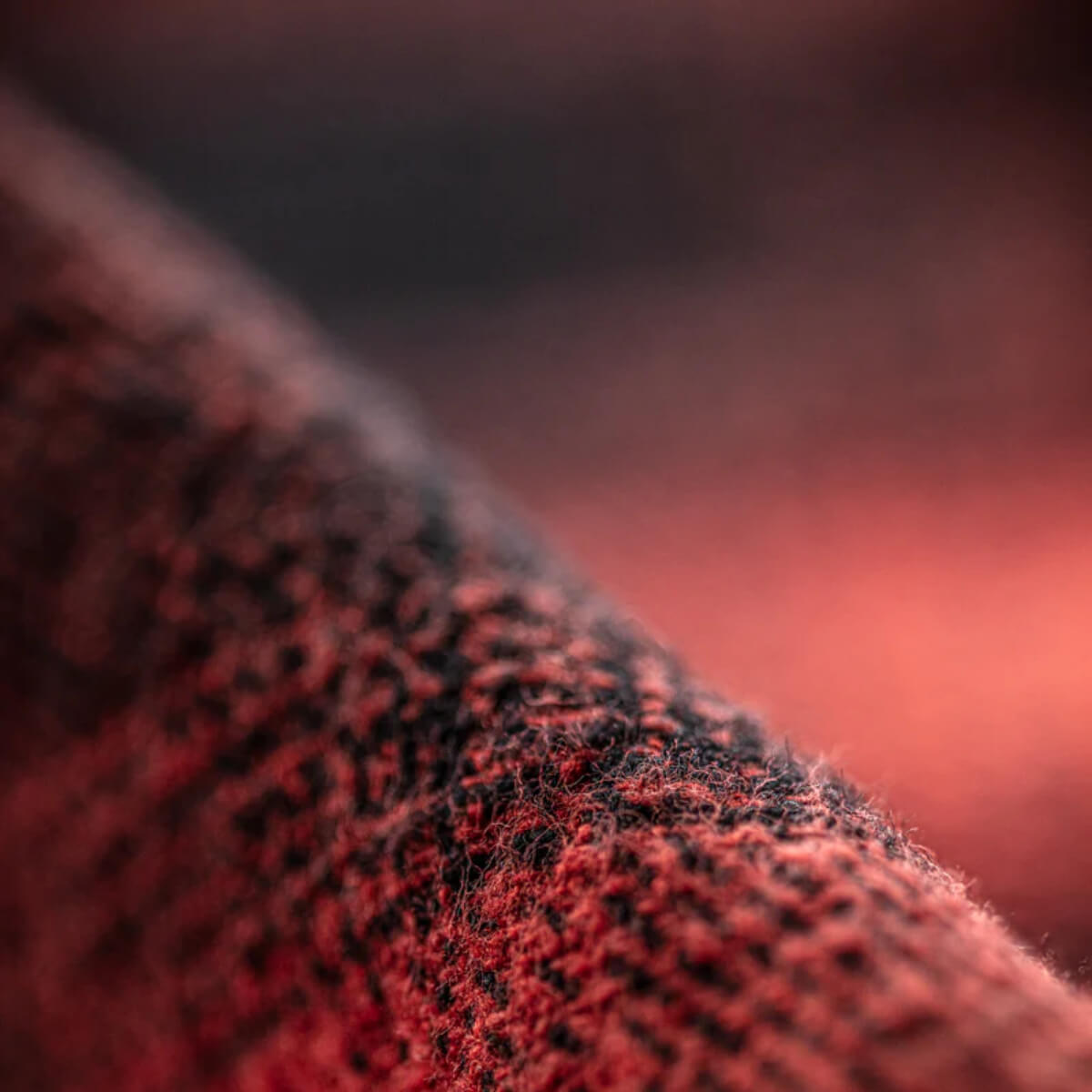 Close-up of textured red fabric with a blurred background