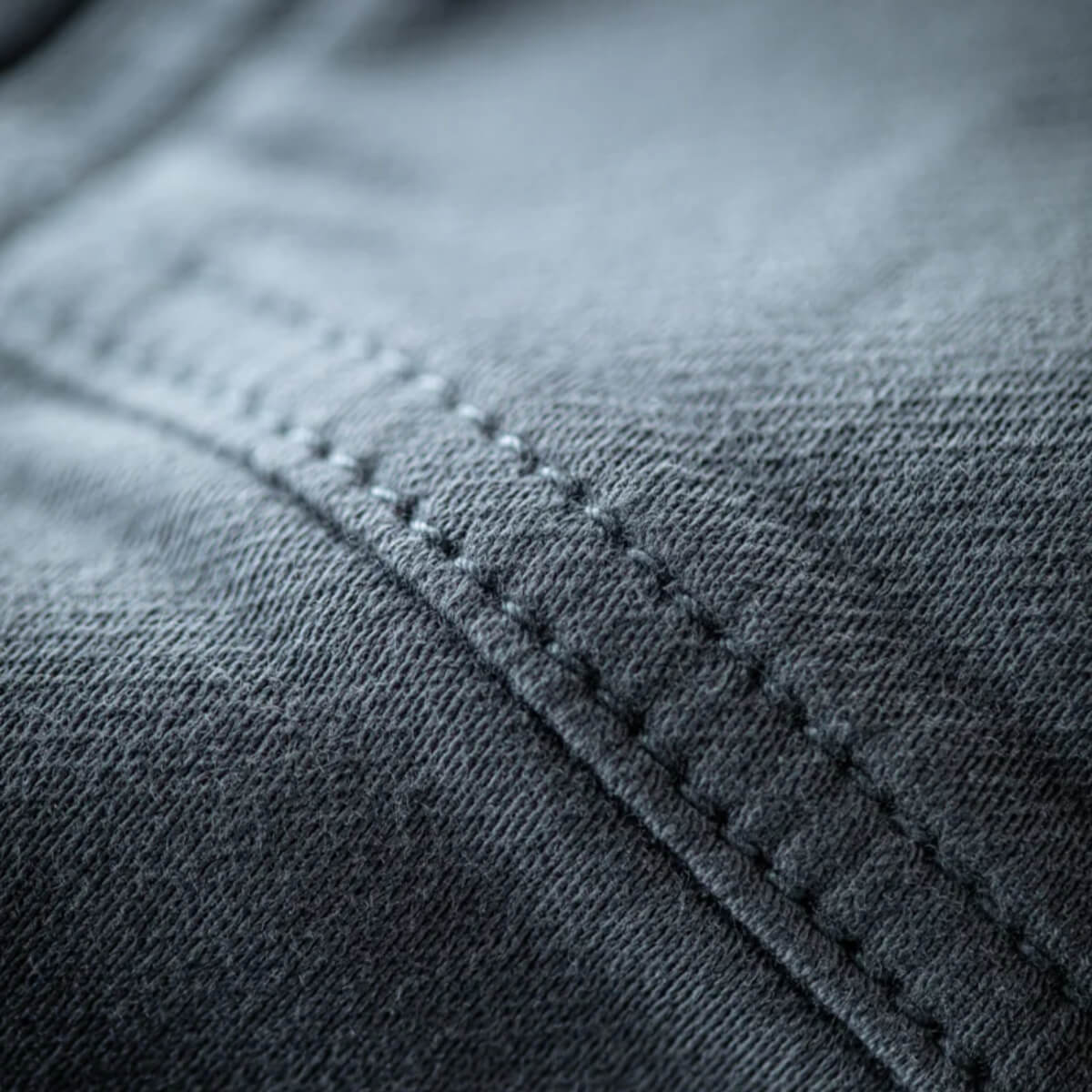 Close-up of gray fabric with stitching detail