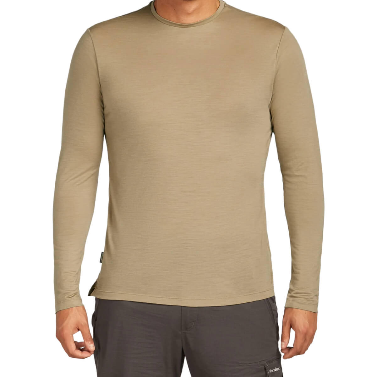 Beige long-sleeve shirt worn by a person on a white background