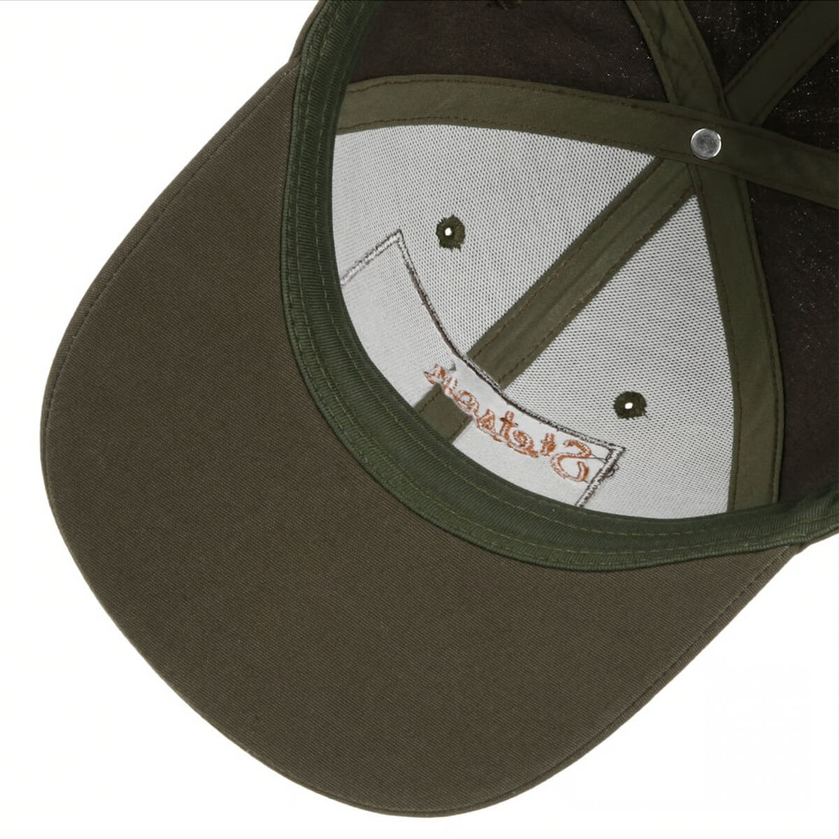 Close-up of a green baseball cap with a visible brand logo on the interior.